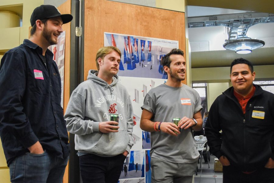 Graduate students Jake Monroe, Cole Coddington, Ezekiel Nelson and Gabriel Hernandez, celabrate after winnning the Hack-A-House competition on Friday evening at Carpenter Hall. They designed a way for farmers to build housing underneath their fields.