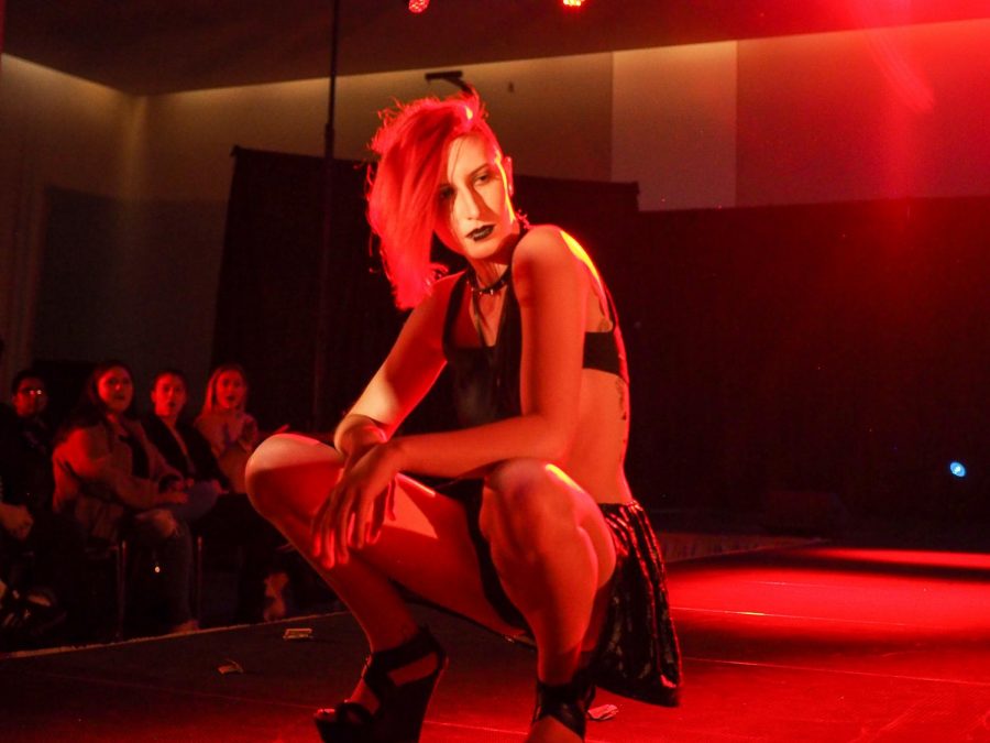 Stephanie Kemp, student model, poses at the end of a runway at the Unity Week Fashion & Drag Show: United We Are Stronger event on Tuesday night at the CUB Senior Ballroom.