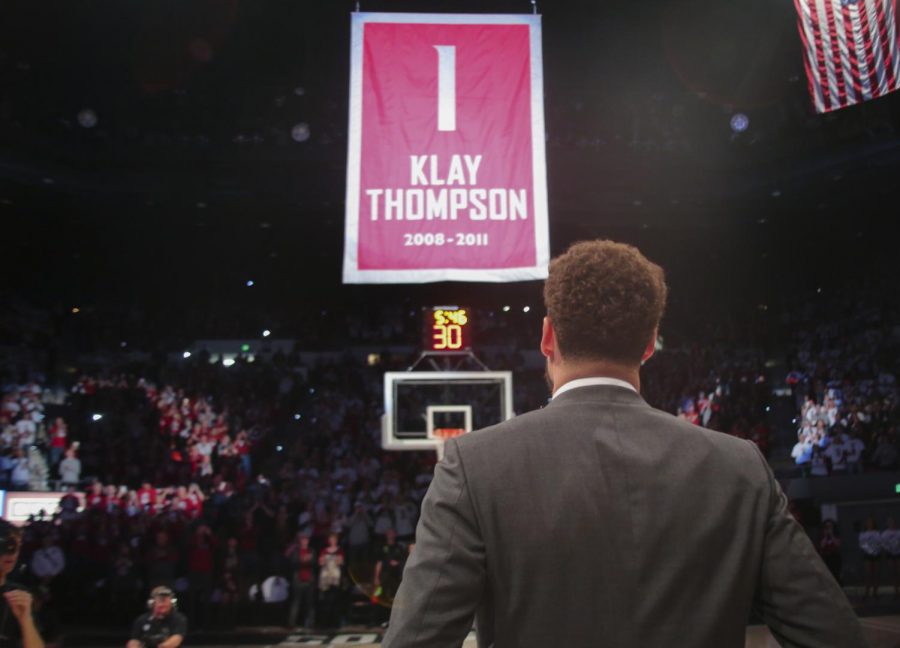 Klay Thompson watches as the banner displaying his jersey number, name and years played at WSU is raised into the rafters at Beasley Coliseum.