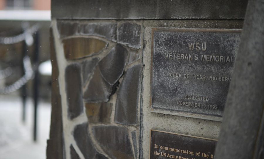 The WSU Veteran’s Memorial stands outside next to Jackson Hall on Sunday. Ray Sun, associate professor in the history department, said the Fallen Cougars Project began in 2017. Sun recruited students from his fall 2017 and spring 2018 classes to work on the project. 