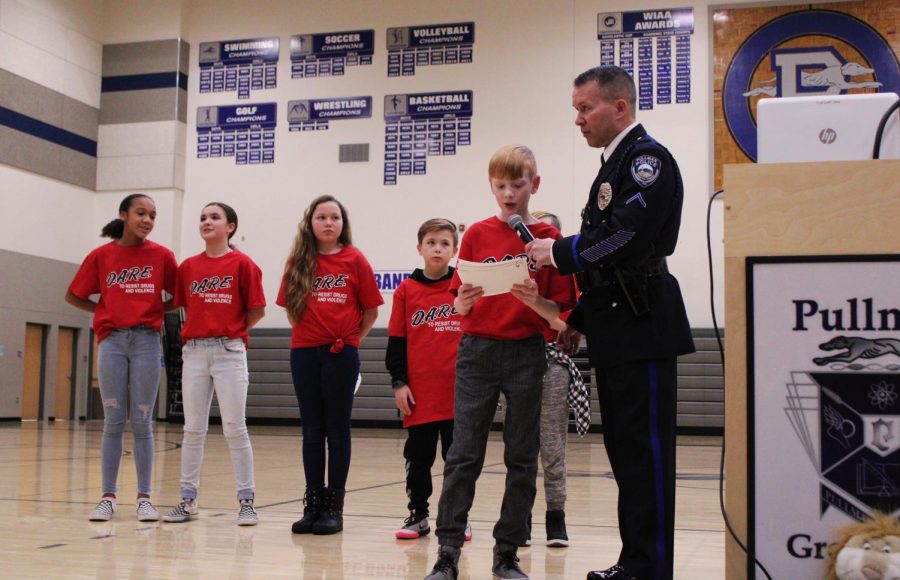 Specially selected fifth grade students from the DARE program give presentations during the graduation on Jan. 15 at Pullman High School. 