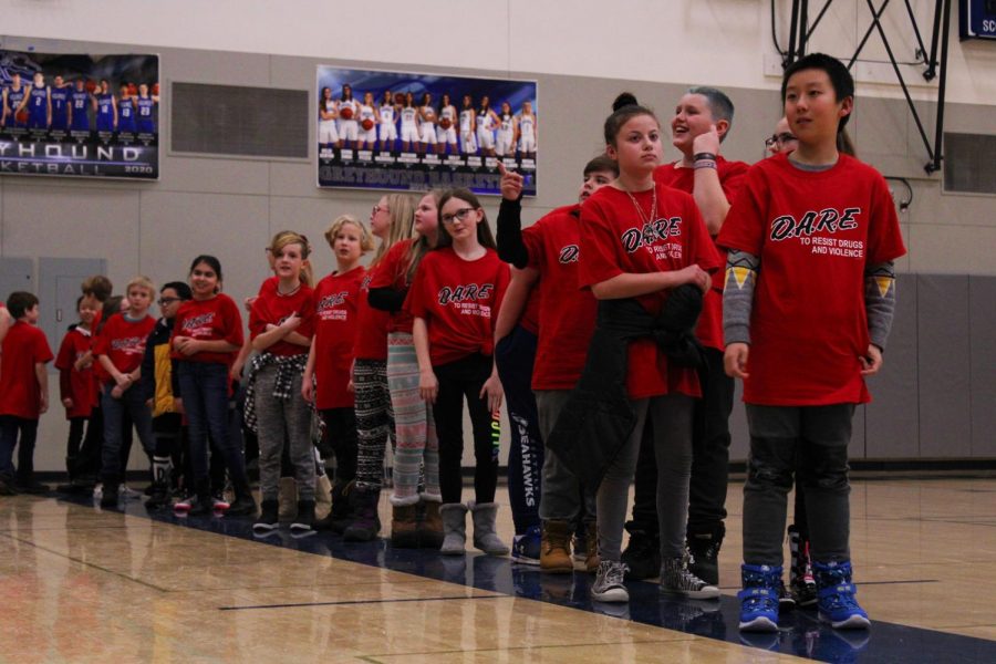 5th grade students line up to get their D.A.R.E. graduation certificates on Wednesday night at Pullman High School. 