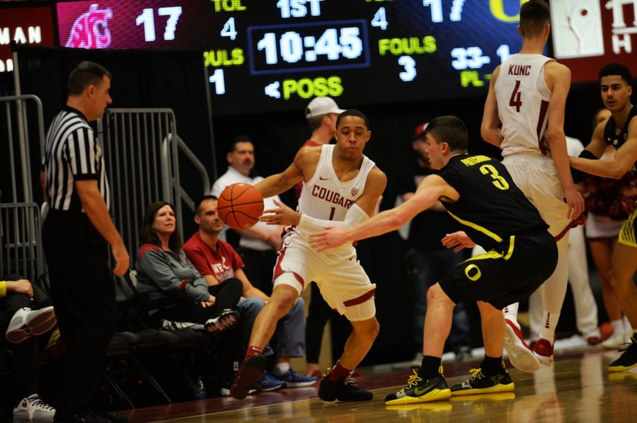 WSU then-junior guard Jervae Robinson dribbles past Oregon then-junior guard Payton Pritchard on March 6 at Beasley Coliseum. 