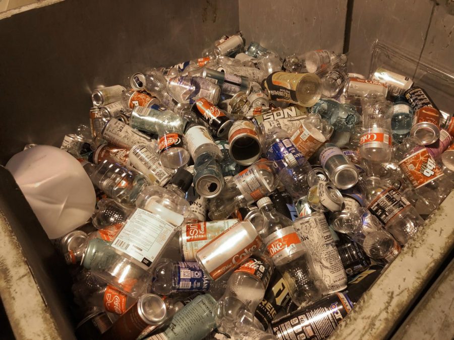 A dumpster full of recyclable plastic bottles stands in the middle of a building. WSU Waste Management enacted the change because China stopped accepting recyclable materials from the United States.