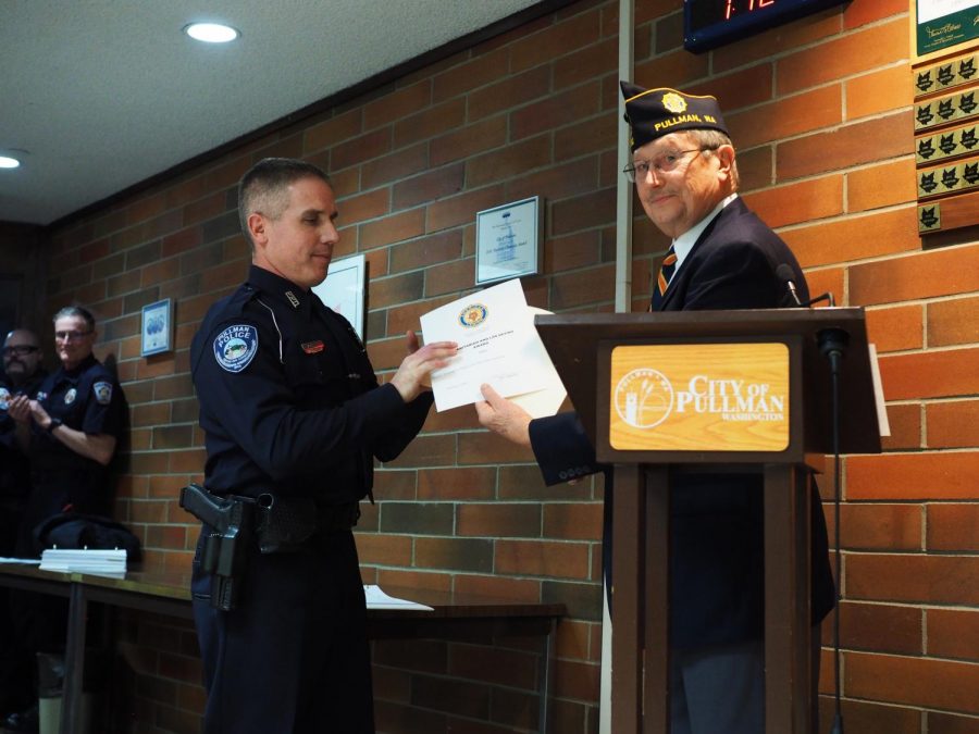 Pullman Police Officer Brian Chamberlin, left, saved a man from suicide, which earned him the 2019 Humanitarian & Life Saving award presented during a Pullman City Council meeting on Tuesday evening at City Hall.