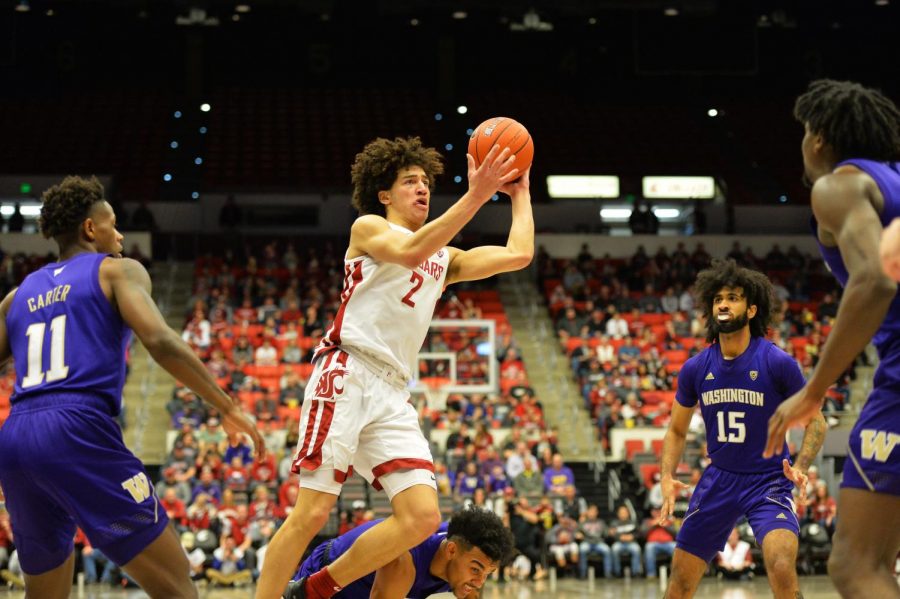 Sophomore guard CJ Elleby throws up a shot after being fouled during the Apple Cup matchup Feb. 9 at Beasley Coliseum.
