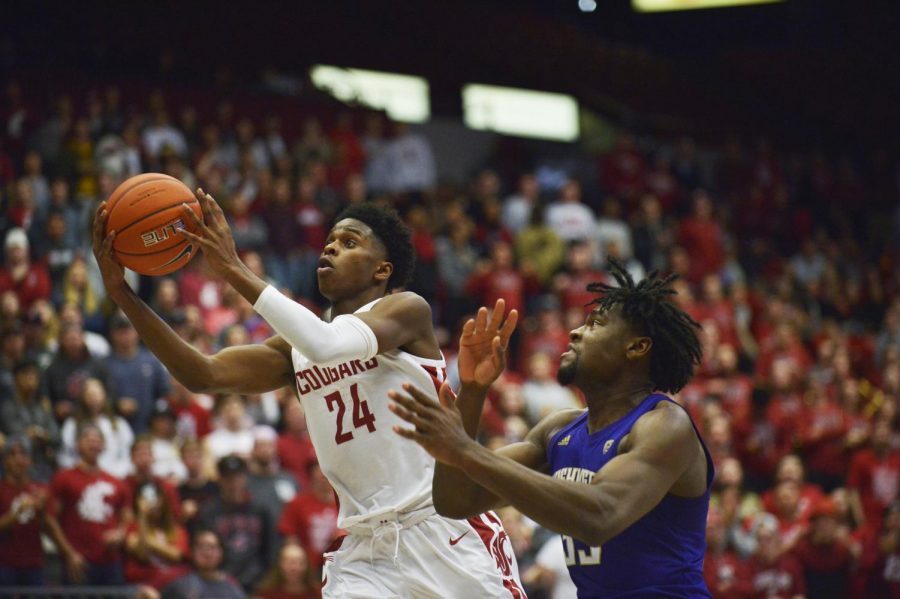Freshman Guard Noah Williams goes up for a lay up on a Husky defender on Sunday afternoon at Beasley Coliseum.