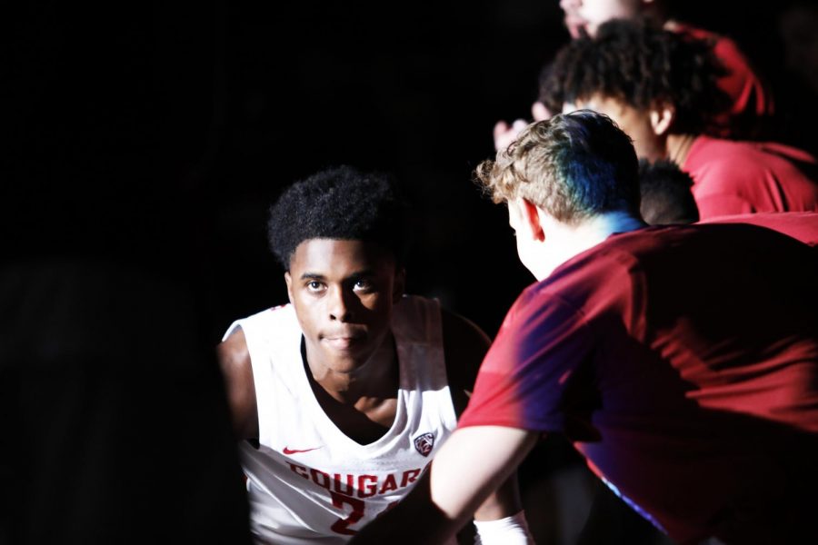 As his name is announced, freshman guard Noah Williams walks through a tunnel formed by his teammates to join the starters at Beasley Coliseum.
