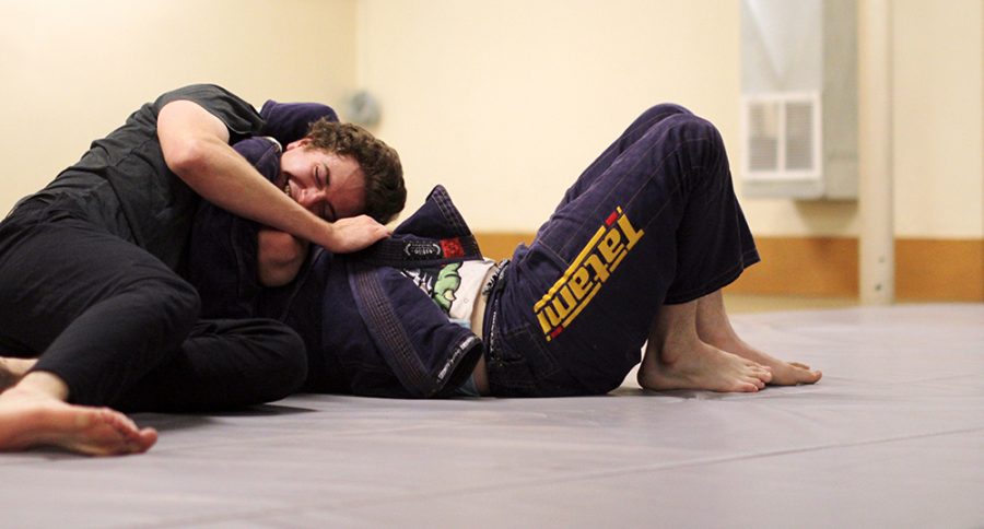 Dustan Cwick, 22, practices Brazilian Jui Jitsu with Francis Dunne, also 22, Thursday evening, Feb. 20 at the Gladish Community and Cultural Center Rec Room.