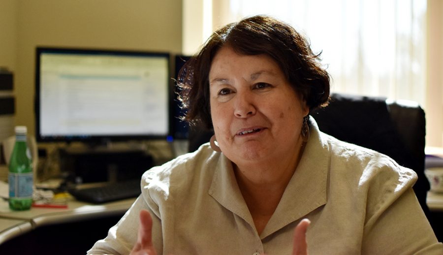 Professor Vilma Navarro-Daniels talks about Spanish literature and film Friday at noon in her office in Thompson Hall. Navarro-Daniels says she enjoys getting to discuss films with students, especially when they are willing to read subtitles to understand.