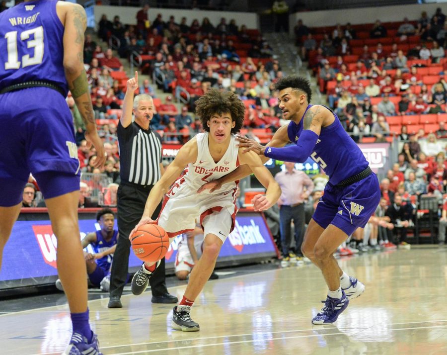 Looking for a gap, sophomore guard CJ Elleby fends off  sophomore guard Jamal Bey during the Apple Cup match up on Feb. 9 at Beasley Coliseum. The cougs will face the Golden Bears on Wednesday.
