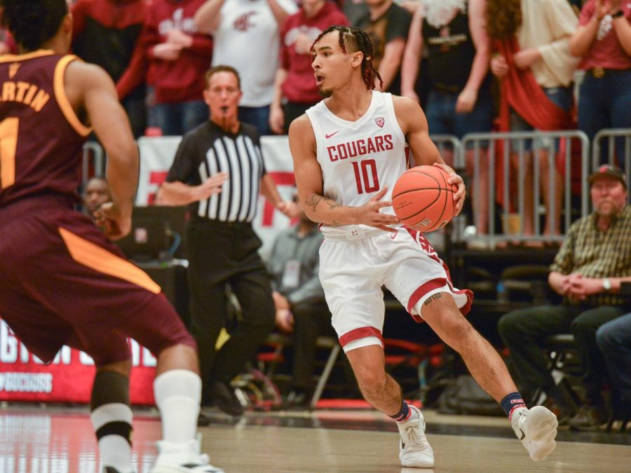 Junior guard Isaac Bonton looks to make a move against Arizona State on Jan. 29 at Beasley Coliseum. The Cougars won the game 67-65.
