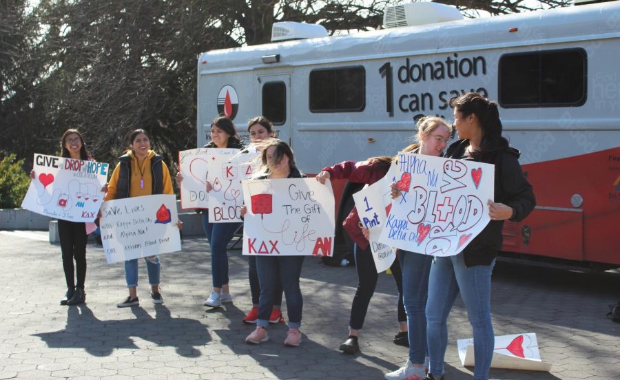 Members of Alph Nu host a blood drive on the Terrell Mall, in front of Murrow hall, on Wednesday afternoon.