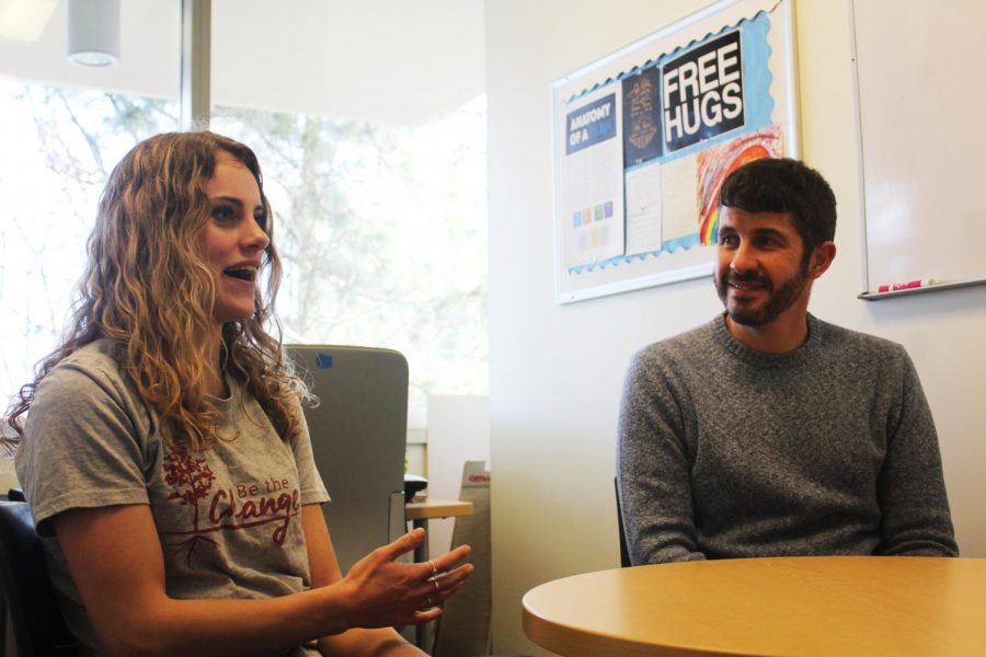 Audrey Weaver, left, Center for Civic Engagement peer mentor, and Ben Calabretta, CCE interim co-director, describe how students can receive help when they visit the CCE on Wednesday at the CCE. 