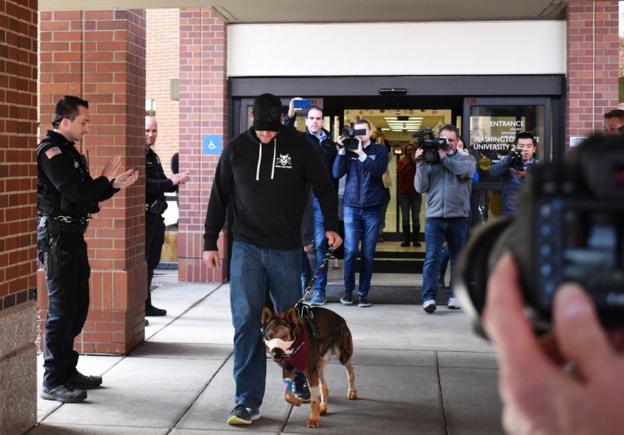 Officer Nick Stewart walks K9 Chief out of the WSU Veterinary Teaching Hospital at 10:30 am.
