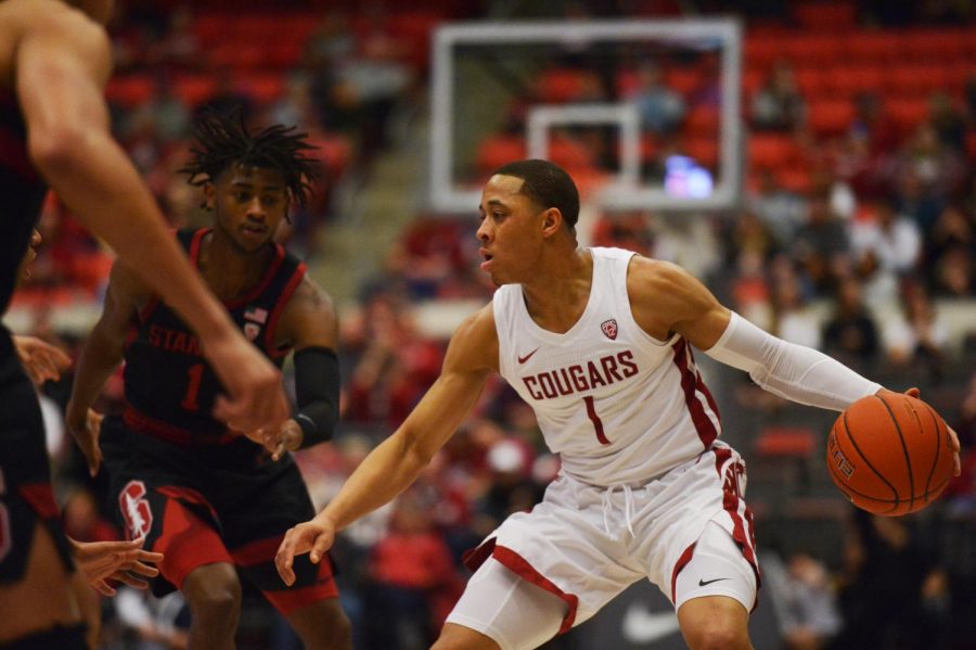 Senior Guard Jervae Robinson attempts to get past Stanford defenders on Feb. 23 at Beasley Coliseum