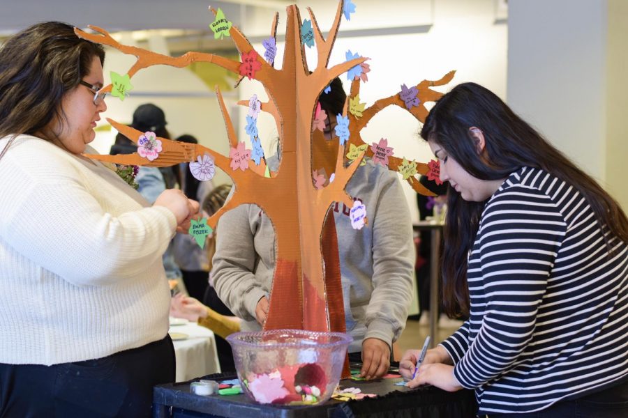 Attendees of the social were able to write the names of honorable women in their lives on leaves. The leaves were hung on a cardboard tree Tuesday afternoon at Wilson-Short.