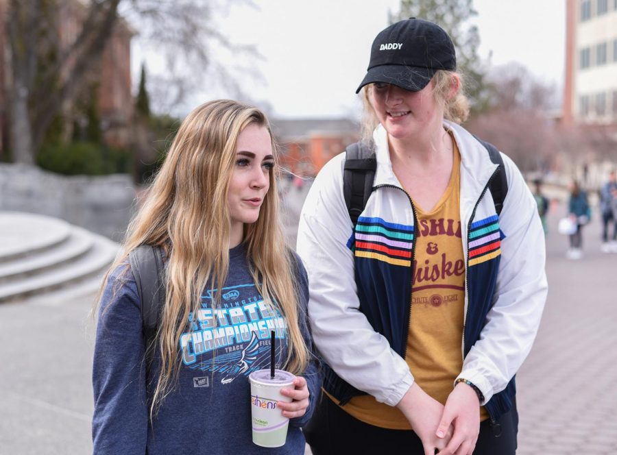 Taylor Bartoschek and Andie Beahkenship, both freshmen at WSU, share their travel plans for Utah and Kansas on a Friday afternoon on the Terrell Mall.