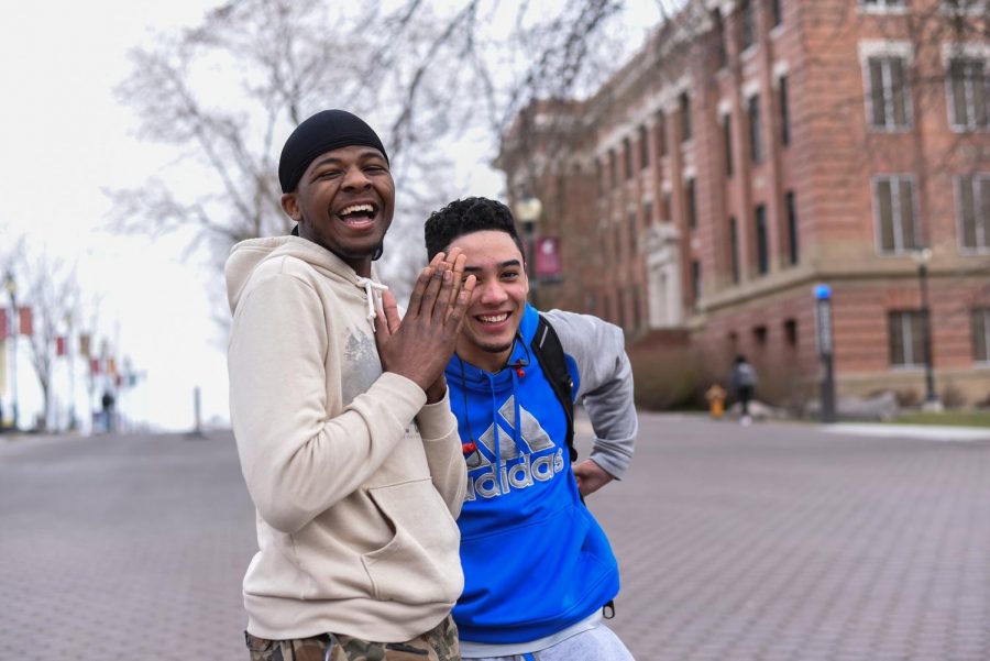 Eo Alex, a sophomore at WSU, and Zane Ingesoll, a freshman at WSU, laugh as they talk about their spring break plans on a Friday afternoon on the Terrell Mall.