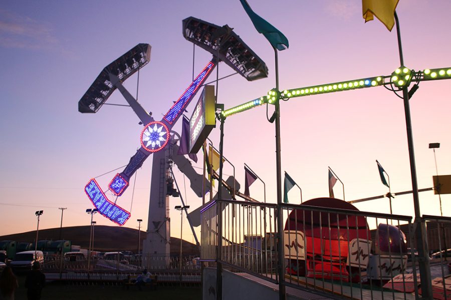 The sun sets behind carnival rides at the Palouse Empire Fair in 2019. 