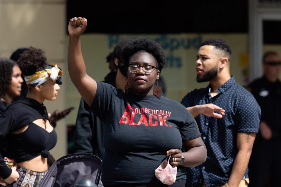 Shevy Byass, president of the Black Student Union at University of Idaho, raises her fist Wednesday at Friendship Square in Moscow, Idaho. 