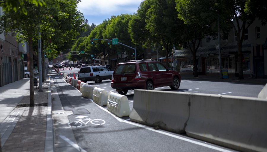 A temporary bike lane and back-in angled parking spots have been added to Main Street. The trial will continue until September. 