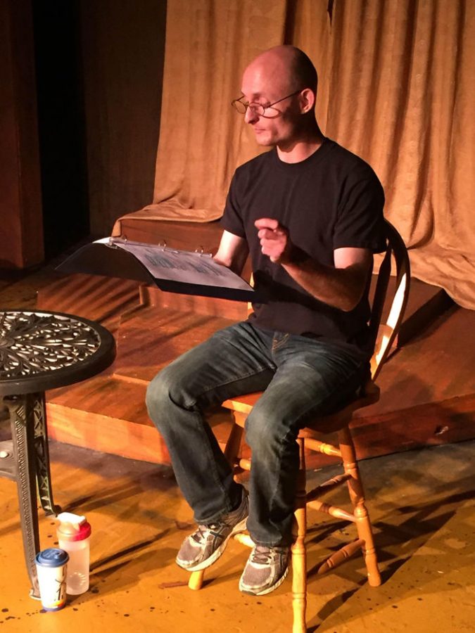 Actor Matt Maw reads from a script during a 2016 readers theater production titled, “The Woman in Black.