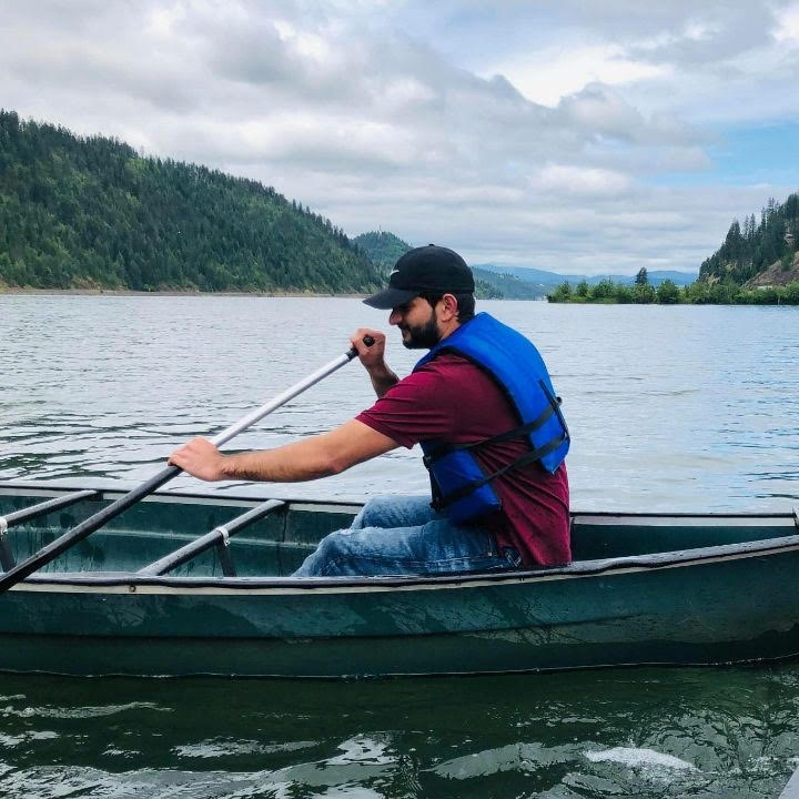 International+student+Mahdi+Zeraat+Pisheh+rows+a+boat+on+Lake+Coeur+dAlene.+He+cannot+see+his+family+in+Iran+because+he+has+an+expired+passport+and+is+unable+to+get+a+new+one.