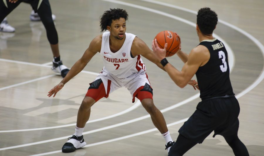 WSU junior guard Myles Warren defends Colorado senior guard Maddox Daniels in the matchup Saturday evening in Beasley Coliseum. The Cougs lost the matchup 59-70.