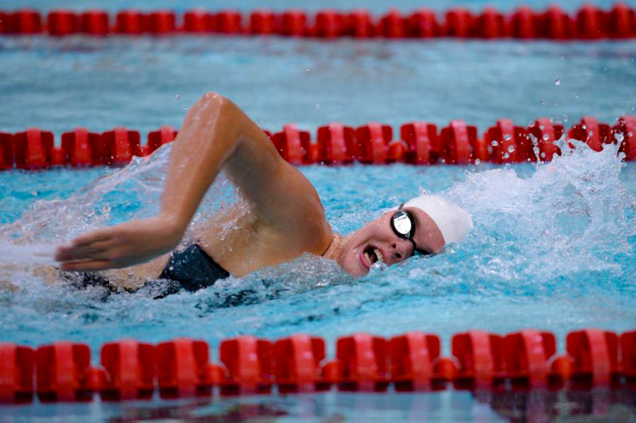 Junior Emily Barrier competes in the freestyle event in Gibb Pool.