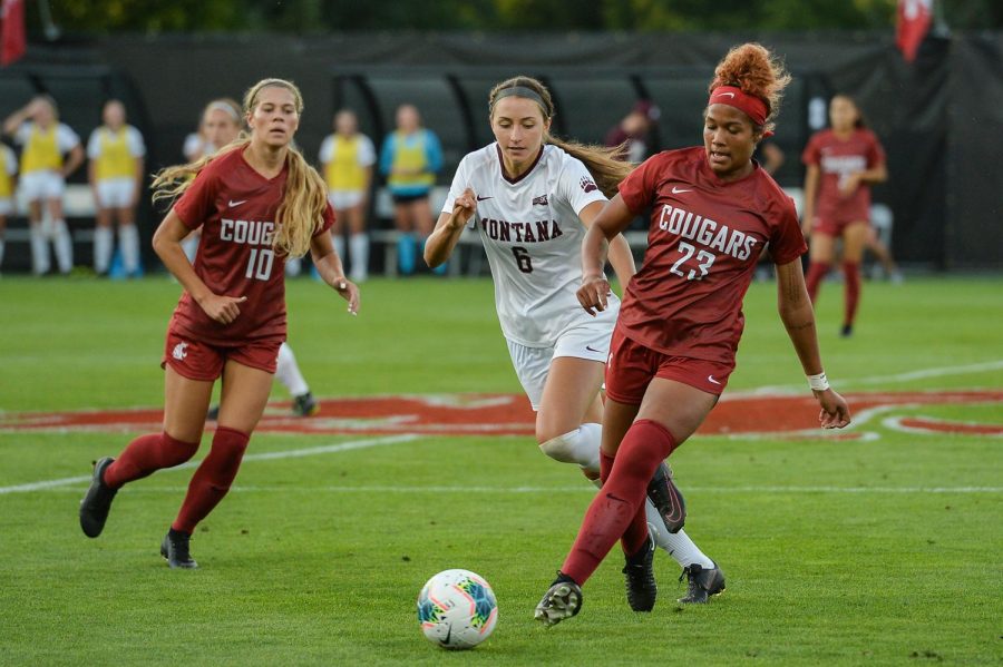 Then-sophomore+defender+Mykiaa+Minniss+fights+off+Montana+player+as+junior+defender+Brianna+Alger+watches+on+Aug.+20%2C+2019+at+the+Lower+Soccer+Field.
