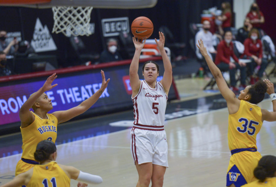 Freshman+guard+Charlisse+Leger-Walker+pulls+up+for+a+shot+over+UW+defenders+in+the+Apple+Cup+matchup+Feb.+28+in+Beasley+Coliseum.