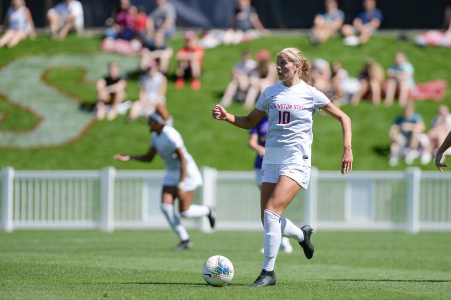 Then-junior defender Brianna Alger looks for where to kick the ball to during the game against James Madison University on Sept. 1, 2019 at the Lower Soccer Field.
