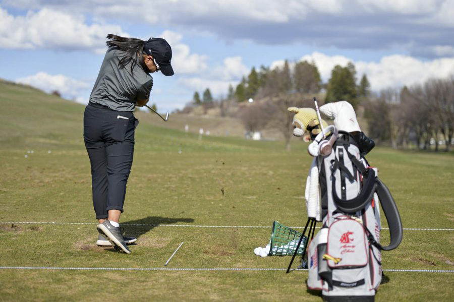 Then-freshman Amy Chu focuses hitting on range at WSU’s practice facility.