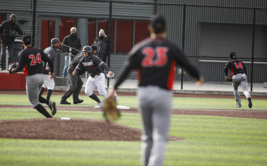 Graduate first baseman/catcher Tristan Peterson takes off from third base as the baseball misses the third baseman during the game against Seattle U March 6 at Bailey-Brayton Field.