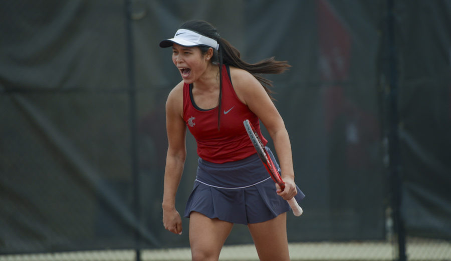 Sophomore+Pang+Jittakoat+celebrates+after+winning+her+singles+match%2C+clinching+the+victory+against+Arizona+Sunday+afternoon+at+the+WSU+Outdoor+Tennis+Courts.
