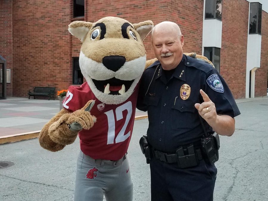 Pullman Police Chief Gary Jenkins, pictured here with Butch T. Cougar, will stay on as chief until a replacement is hired.