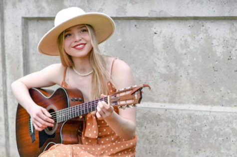Izzy Burns, pictured here, said her grandfather and mother would play music for her during her recovery period after surgery.