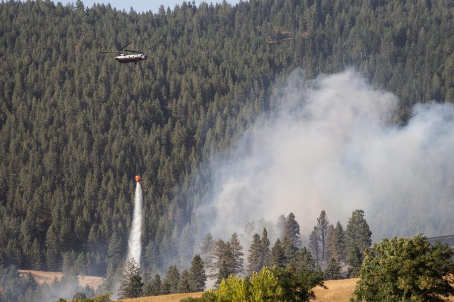 An aerial firefighting crew pours water over the Idler fire. Firefighters continue to fight the flames reporting less than 50 percent containment. 
