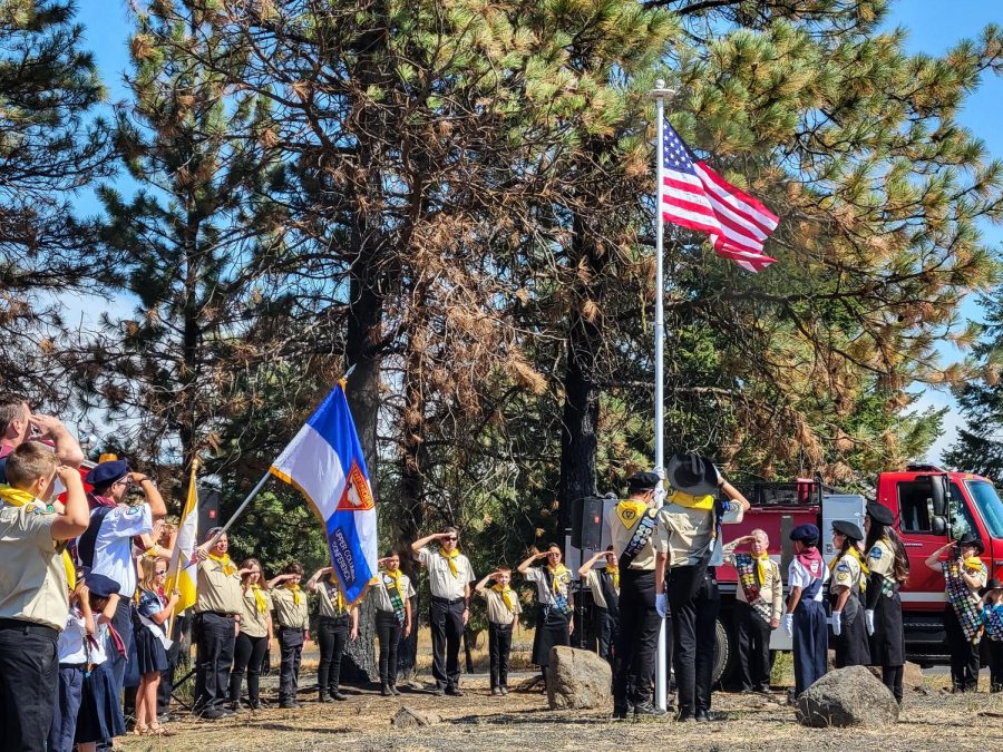 Upper Columbia Academy Pathfinders raise a new flag over the town of Malden, signifying a new age, one year after the Babb Road Fire engulfed the valley. 