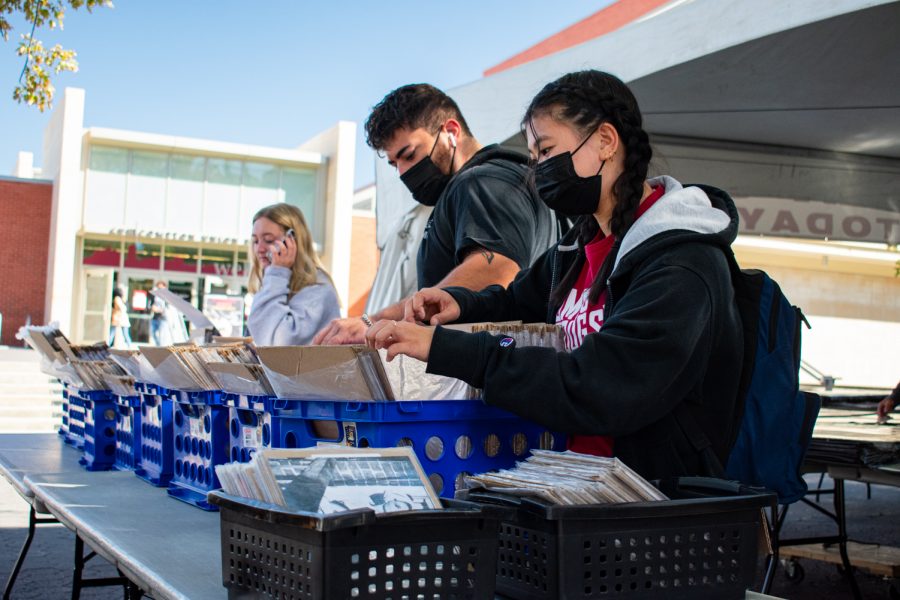 At Terrell Mall, students browse through bins of posters, hoping to find a hidden gem to decorate their dorms and apartments at Washington State University in Pullman, Wash., Friday, Sept. 3, 2021.