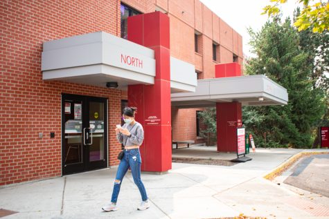 A student walks past the Cougar Health Services psychological department on the south side of campus. 