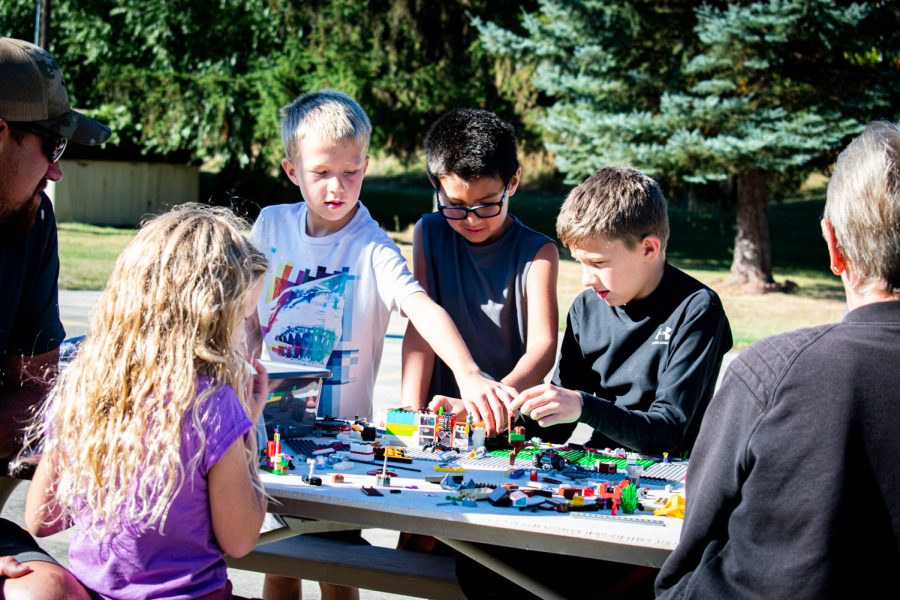 A group of LEGO fans construct their haunted house Saturday morning at the LEGO building challenge in Garfield. 