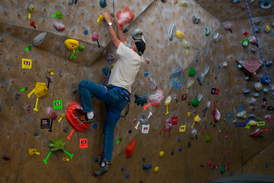 A participant at the CKC event climbs on the WSU Student Recreation Center climbing wall Sunday, Sept. 26.