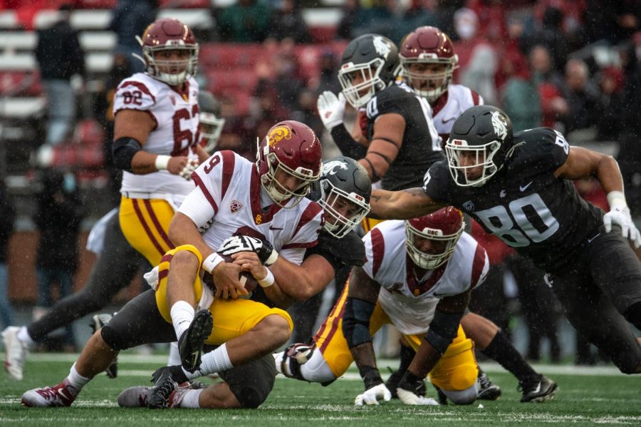 WSU defensive end Andrew Edson (85) sacks USC quarterback Kedon Slovis (9) during the first half of a college football game Sept. 18 in Pullman.