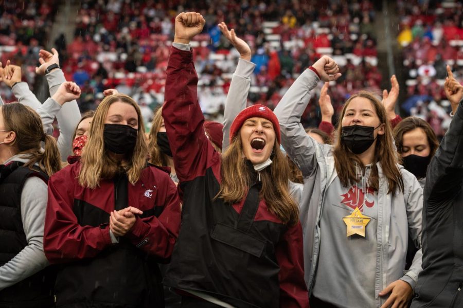 The Washington State University Womens Rowing Team celebrates during their recognition at a college football game, Saturday, Sept. 18, 2021, in Pullman, WA.