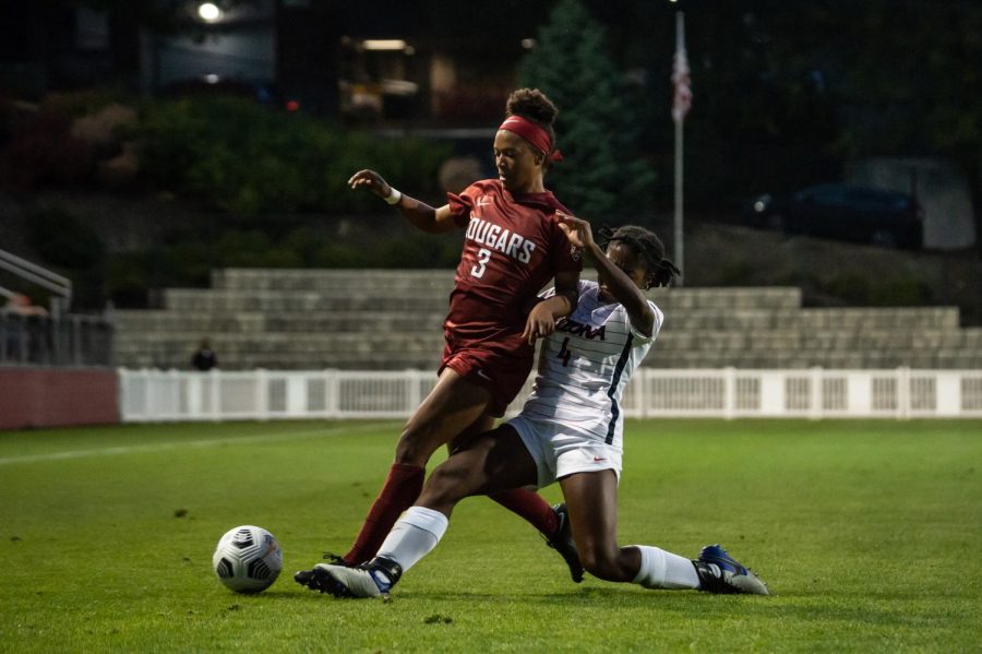 WSU forward Enzi Broussard battles Arizona defender Jasmine Young for the ball during the second half of a match Sept. 24, 2021, in Pullman.