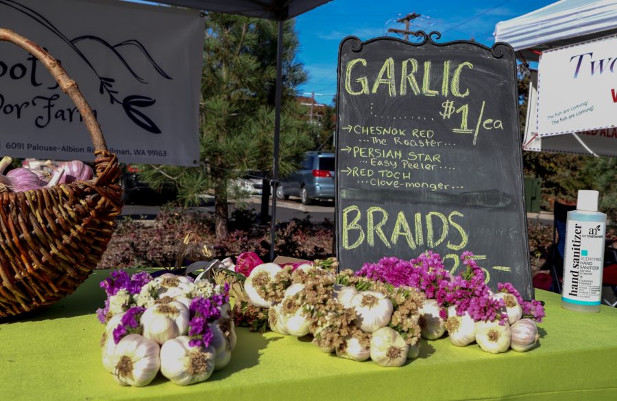 Hand-made garlic braids stand at the Pullman Farmers market, Wednesday, Sept. 29, 2021.