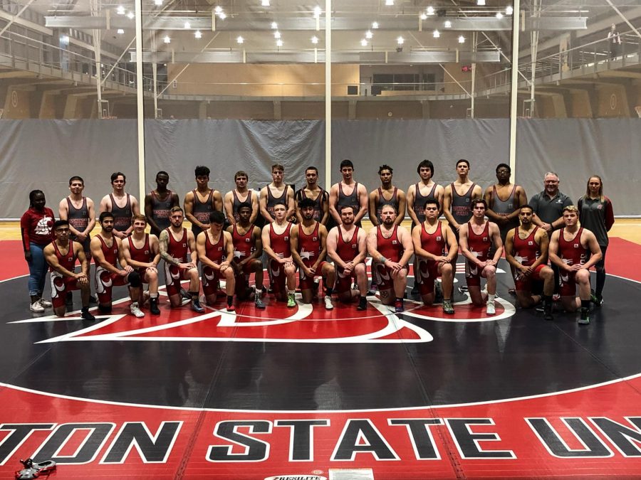 WSU+wrestling%E2%80%99s+2019+team+poses+for+a+team+photo.+The+team+featured+12+national+qualifiers+and+an+All-American.