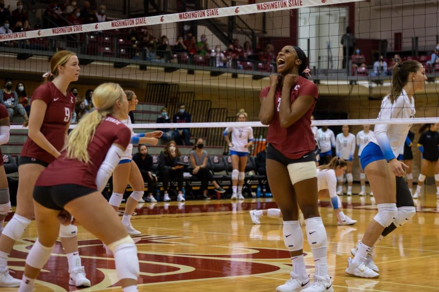 WSU's Kalyah Williams (2) celebrates during a college volleyball match against UCLA Oct. 3 in Pullman. 